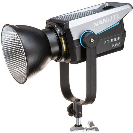 Bi-color LED studio light with front reflector and yoke mount, black/silver