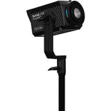 Black RGB LED spotlight angled toward camera with blue lens accent ring