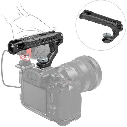 Cold shoe adapter attached to camera top, showing integrated screw knob and mounting holes