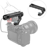 Cold shoe adapter attached to camera top, showing integrated screw knob and mounting holes