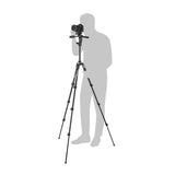Black camera tripod set up beside standing figure silhouette for height scale
