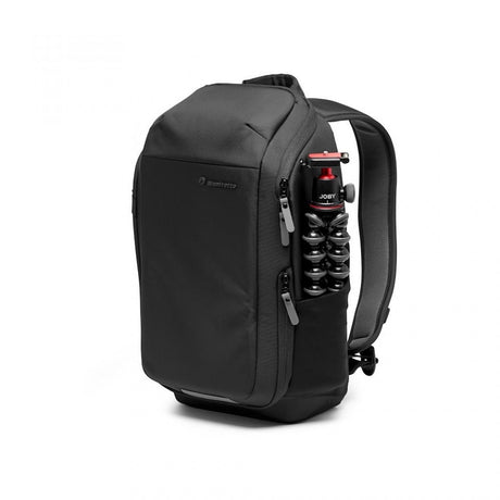 Compact camera backpack with external side pocket and tripod holder on the back