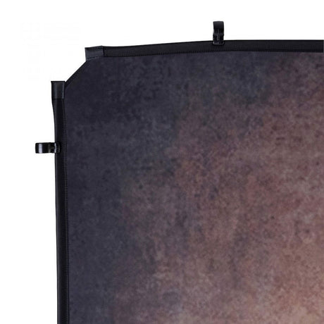 Close-up of dark walnut backdrop edge with black strap and top grommet loops