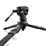 Fluid video head mounted on three-section tripod legs, close-up view