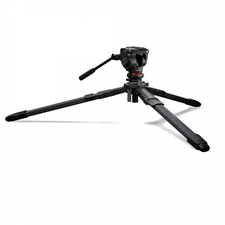 Tripod with fluid head and three black carbon legs, spread for low-angle setup