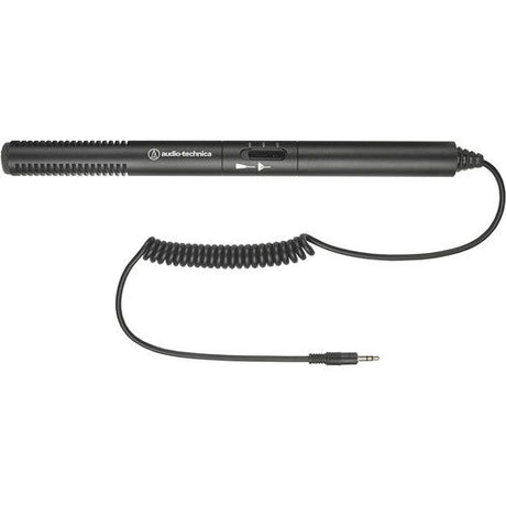 Black shotgun microphone with coiled cable and audio plug, side view
