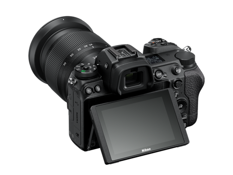 Black mirrorless camera with 24-70mm lens, angled rear view