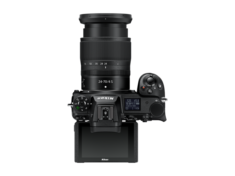 Mirrorless camera with 24-70mm f/4 lens, lens pointing up, back LCD visible