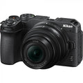 Black mirrorless camera kit with 16-50mm lens, front view