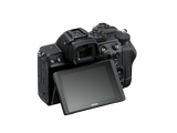 Mirrorless camera back view with LCD screen and control dials