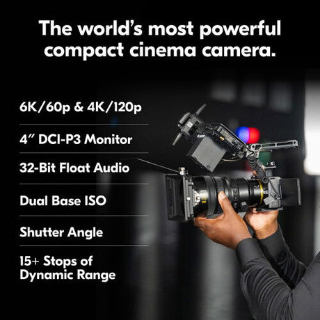 Compact cinema camera rig with mounted monitor and hand adjusting controls
