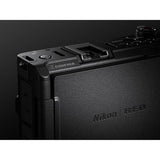 Close-up of mirrorless camera top and side control panel, black