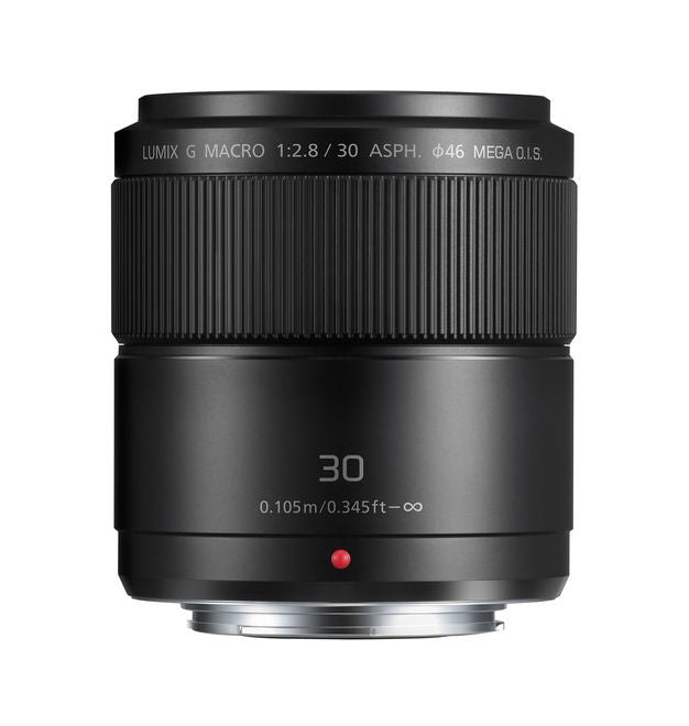 Black 30mm macro camera lens, ribbed focus ring and front glass