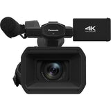 Black camcorder front view showing lens, grille microphone, and 4K label
