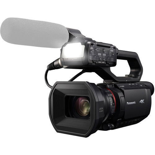 Black 4K camcorder with large lens, LCD screen, and side handle