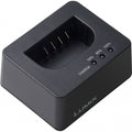Compact battery charger base with charging bay and indicator lights (50/80/100%).