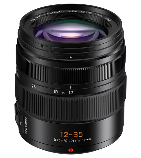 Front view of black 12–35mm lens showing glass element and focus markings