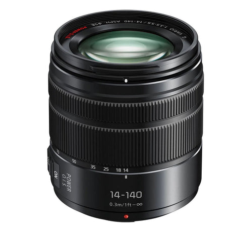 Lumix 14-140mm camera lens, black body with front glass and focal-length markings
