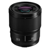 Black L-mount 35mm f/1.8 lens, front glass and ribbed barrel