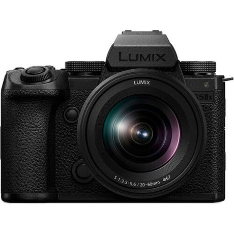 Black mirrorless camera front view with 20–60mm zoom lens and LUMIX markings