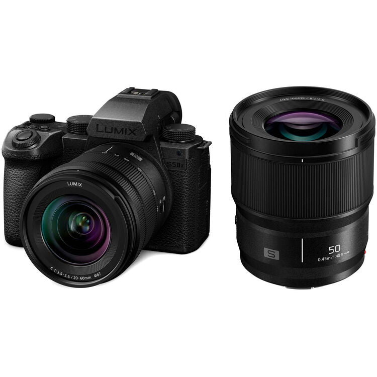 Mirrorless camera with 20–60mm zoom and 50mm lens, black body