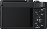 Black compact camera rear view with LCD screen and function button dial