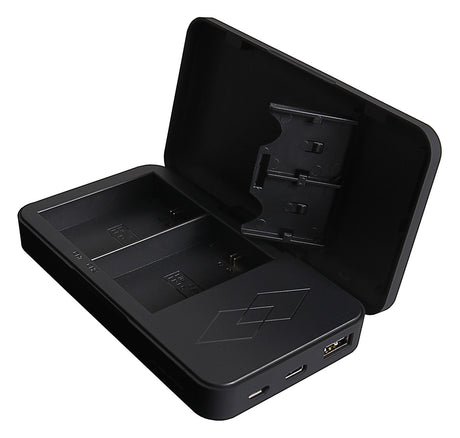Black dual charging dock open view with battery contacts and power connectors
