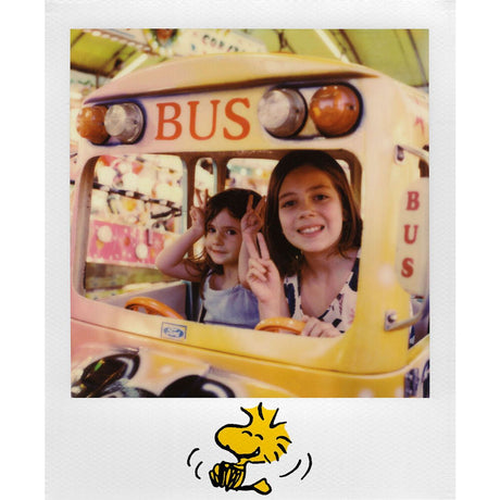 Peanuts i-Type instant photo card: two kids posing in a bus, Snoopy sketch