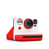 Red instant camera angled front view with flash, lens, and control buttons