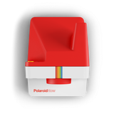 Red and white instant camera front with rainbow film stripe and PolaroidNow logo