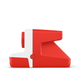 Red and white instant camera side view with grip and front control dial