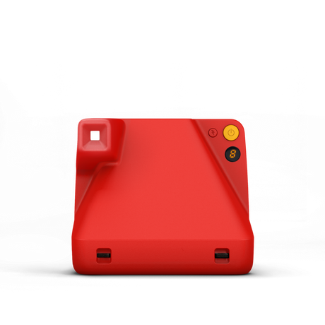 Red instant camera back view with ports and yellow power button