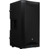 Black powered speaker rear-left angle showing vent grille and port panel.