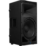 Black powered speaker side view showing large woofer and connection panel.