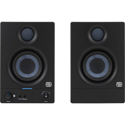Pair of black studio monitor speakers, showing tweeter grille and blue-ring woofer.