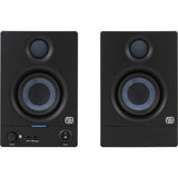 Pair of black studio monitor speakers, showing tweeter grille and blue-ring woofer.