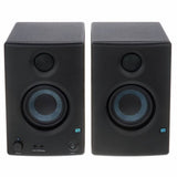 Black multimedia speakers, front view showing volume and power controls below woofers