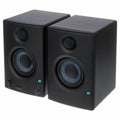 Black multimedia monitor speakers, front pair view with tweeters and woofer rings