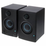 Black multimedia monitor speakers, front pair view with tweeters and woofer rings