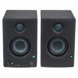 Front view of left and right dark speakers with tweeters and controls