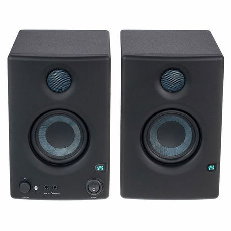 Front view of left and right dark speakers with tweeters and controls