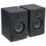 Front view of two dark studio monitors showing tweeters and woofers