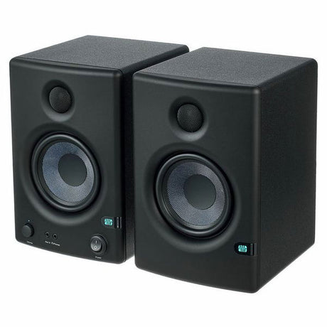 Pair of black studio monitor speakers with woofer and tweeter grilles