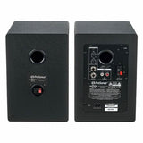 Back panel of two black studio speakers with input terminals and power labels