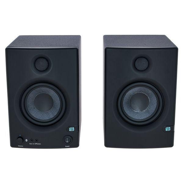 Black studio monitor pair, close-up front with tweeter and woofer cones