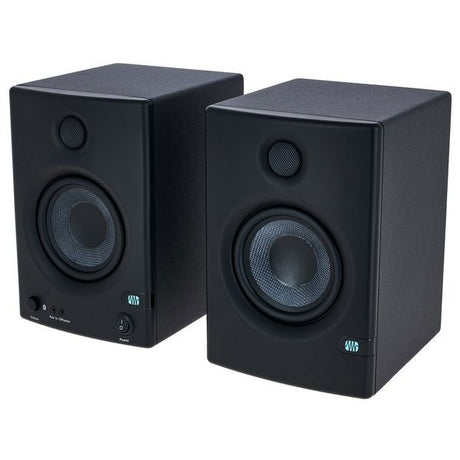 Pair of black studio monitors with tweeters and woofers, front view