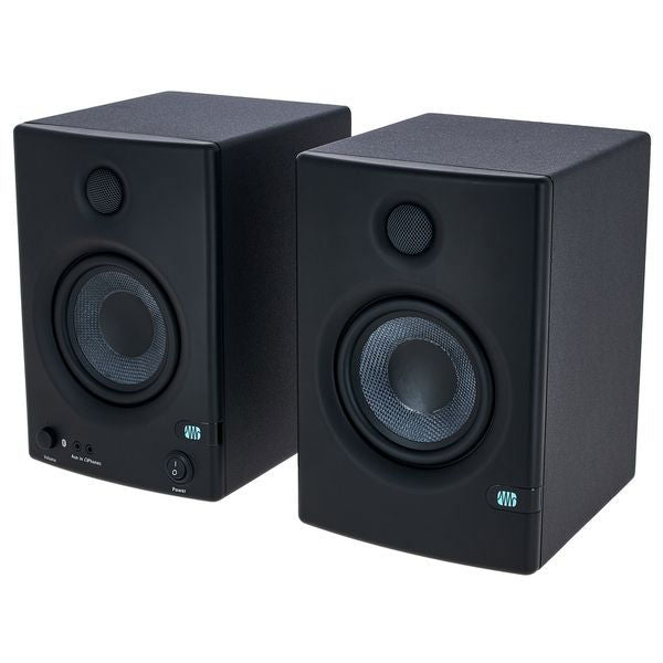 Pair of black studio monitors with tweeters and woofers, front view