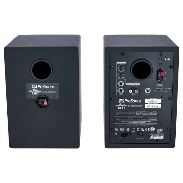 Back panel of black studio monitor speakers with input ports and controls