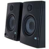 Close-up angled front of black studio monitor speakers, tweeter and woofer