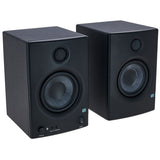 Angled view of black studio monitors showing tweeter and woofer drivers